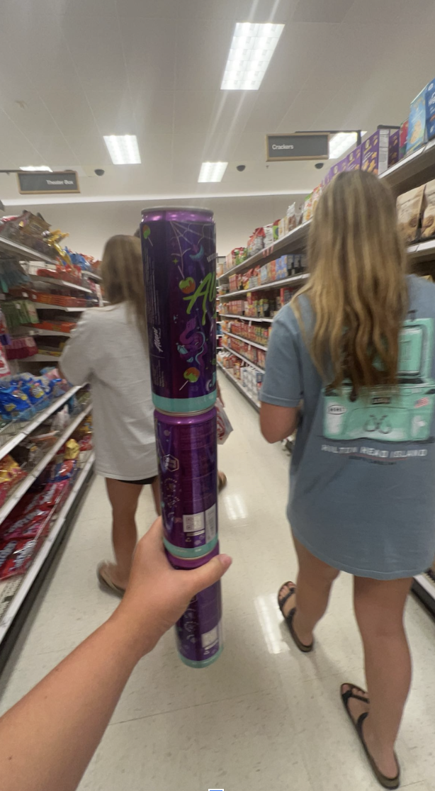 A student stalking up her energy drinks for the long beach days!

